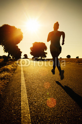 Woman running on sunset