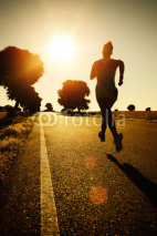 Naklejki Woman running on sunset