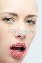 Portrait of sexual beautiful blonde with lips sprinkled sugar is