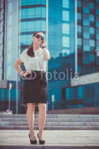 Fototapety Successful businessman talking on cellphone.