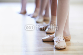 Naklejki Close Up Of Feet In Children's Ballet Dancing Class
