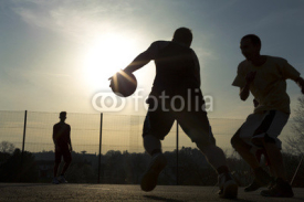 Naklejki Basketball player silhouettes playing outdoors