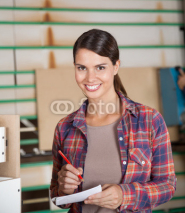 Fototapety Confident Carpenter Holding Pencil And Paper