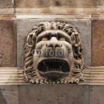 Fototapety Sculpture of a fierce lion muzzle