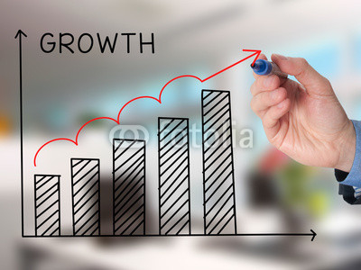 Businessman hand drawing Growth Graph with marker