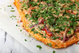 Naklejki Homemade pizza on baking paper close up