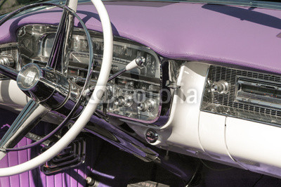 classic car dashboard and steering wheel circa 1950