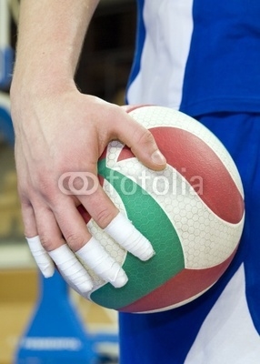 Taped fingers of volleyball player