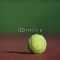 Naklejki Tennis ball on the court