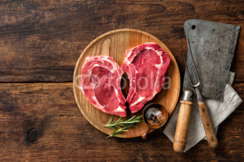 Naklejki Heart shape raw fresh veal meat steaks