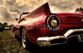 Naklejki Close up shot of a vintage car in sepia color tone
