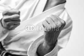 Fototapety Bare fists of a man dressed for martial arts