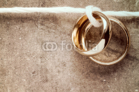 Naklejki Golden rings hanging on rope