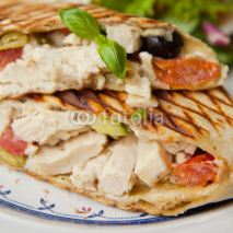 Fototapety Wrap tortilla chicken olives basil salad tomato