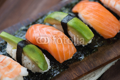 Close-up of sushi with salmon, shrimp and avocado