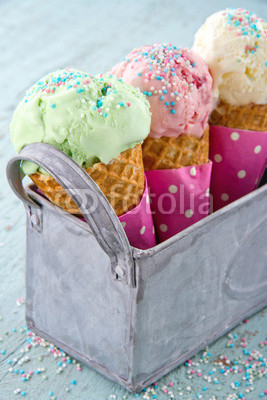 Sprinkles on three ice cream cones