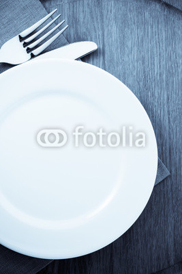 plate, knife and fork  at cutting board