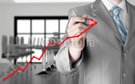 Fototapety Business man drawing a growing graph