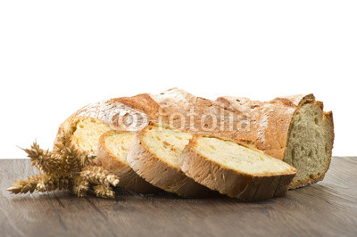 Homemade bread sliced close up on white