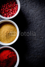 Naklejki Assorted spices on stone background