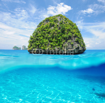Uninhabited island with white sand bottom underwater view