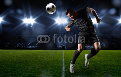 Hispanic Soccer Player heading the ball