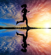 Naklejki Running girl at sunset silhouette