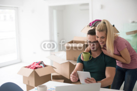 Young couple moving in a new home