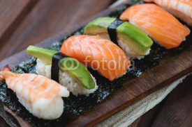 Naklejki Sushi with salmon, shrimp and avocado, close-up