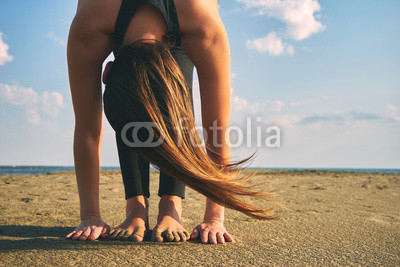Woman practicing yoga in various poses (asana)