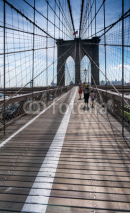 Fototapety View along Brooklyn bridge with pedestrians walking, New York, USA.
