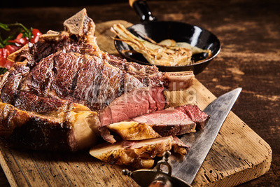 Tender medium rare steak with knife
