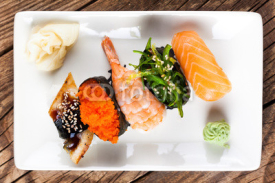 Naklejki fresh sushi on wooden background