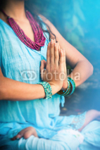 Naklejki woman in meditation yoga position closeup