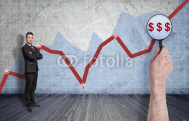 Businessman standing on the background of rising diagram