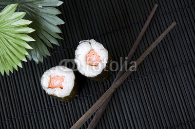 chopsticks with sushi