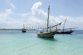 Fototapety Wooden boat on turquoise water in Zanzibar, Tanzania, Africa