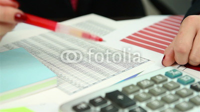 Businesswoman checking budget, close up