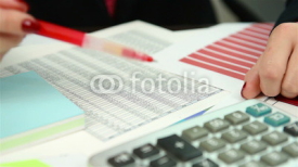 Naklejki Businesswoman checking budget, close up