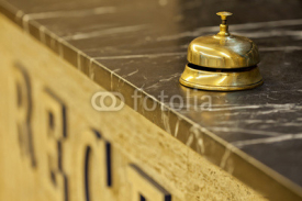 Obrazy i plakaty old hotel bell on a marble stand