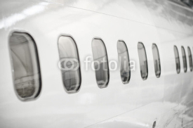 Naklejki Passenger aircraft windows. View from outside.