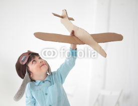 Naklejki happy boy play in airplane  indoors