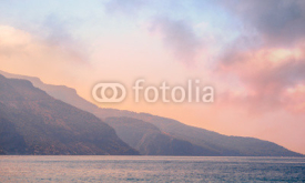 Naklejki Mountains landscape on the coast at sunrise - serenity and rose quartz colors.