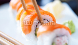 Naklejki eating sushi with chopstricks panorama photo