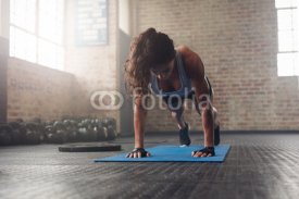 Fototapety Young muscular woman doing core exercise