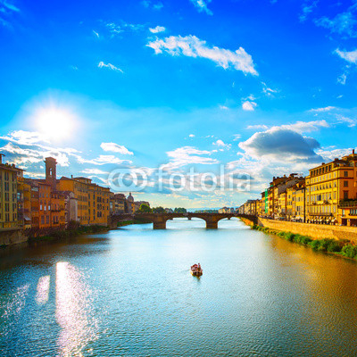 Santa Trinita Bridge on Arno river, sunset landscape. Florence,