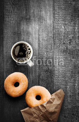 Freshly baked doughnuts with filter coffee