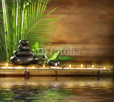 Beautiful spa composition with reflection on water surface