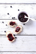 Fototapety Fresh bread with homemade butter and blackcurrant jam