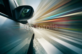 Naklejki Car driving in city, blurred motion background.